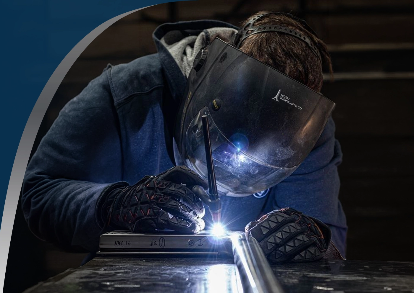 Coded welder joining structural steel with an arc welding process