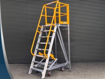 Fixed steel access ladder on the side of a building